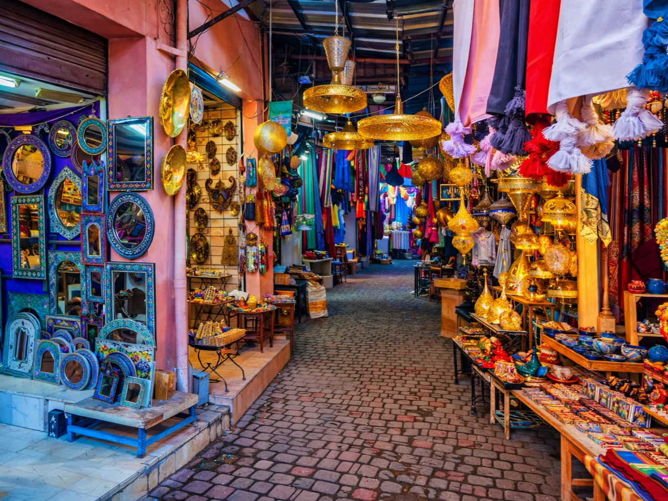 Colourful souk in Marrakech with lamps, textiles and traditional craftsmanship
