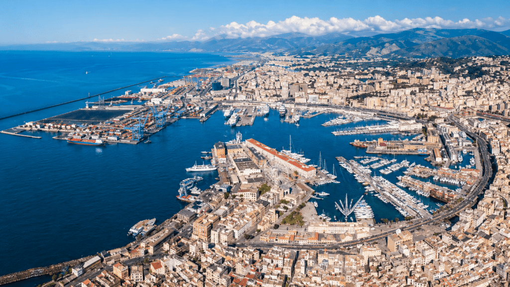 Aerial view of Genoa with Porto Antico, Marina, historic city center, Mediterranean Sea and Ligurian coast for private flights from Switzerland.
